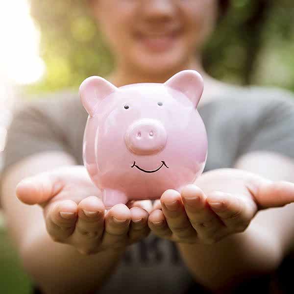 smiling piggybank encouraging donations